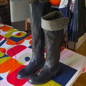 Knee high Cole Haan boots with herringbone detail.